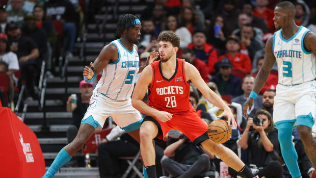 Rockets center Alperen Sengun (28) controls the ball as Charlotte Hornets center Mark Williams (5) defends during the second quarter at Toyota Center